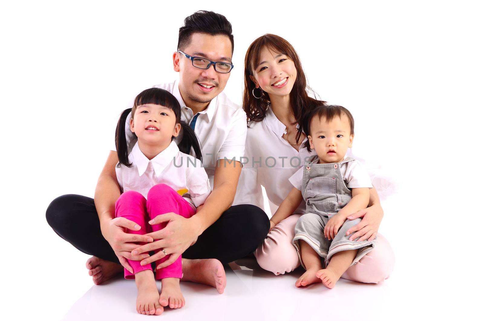 Indoor portrait of a happy asian family