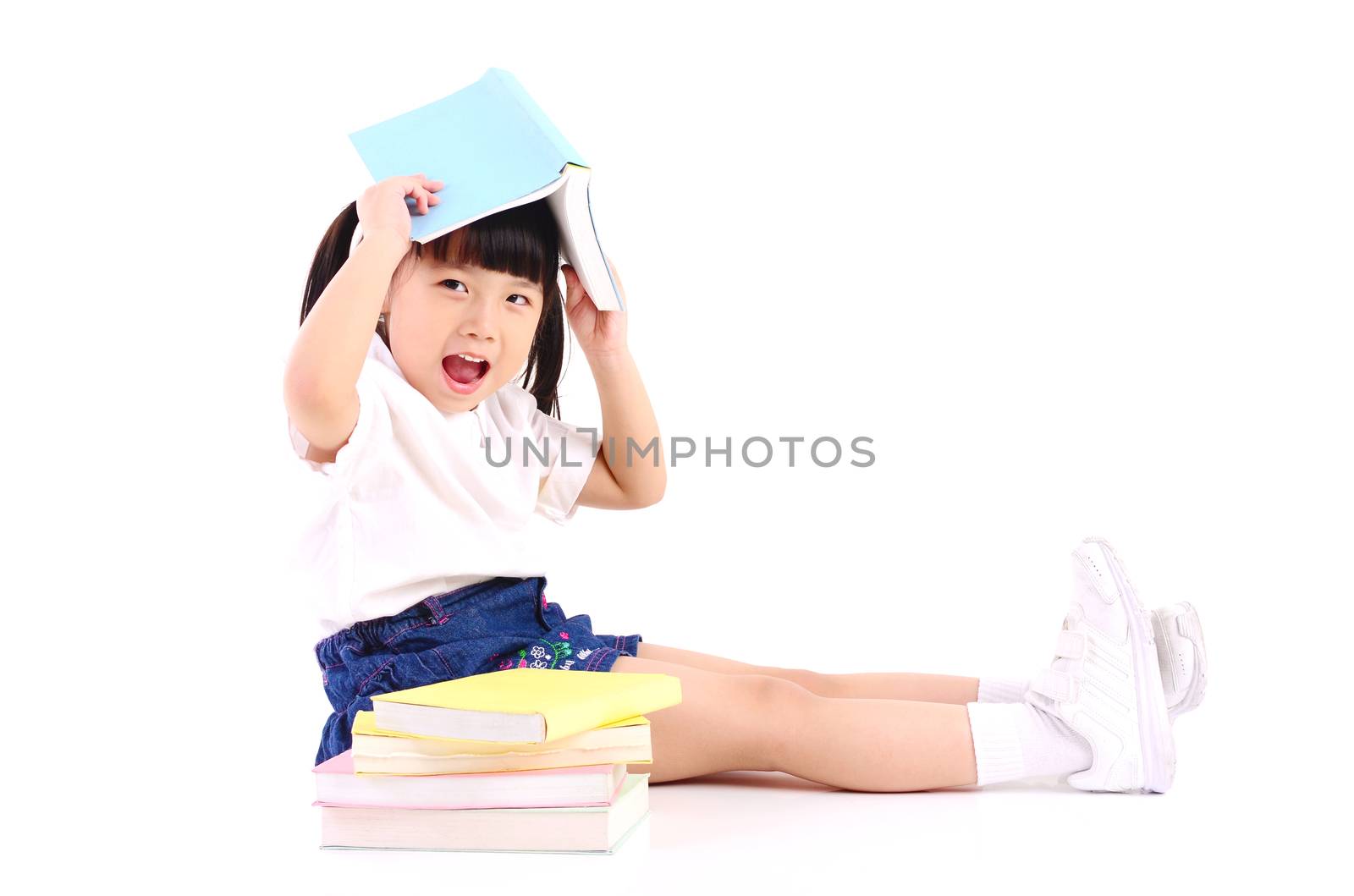 Asian girl sitting on the floor and reading book