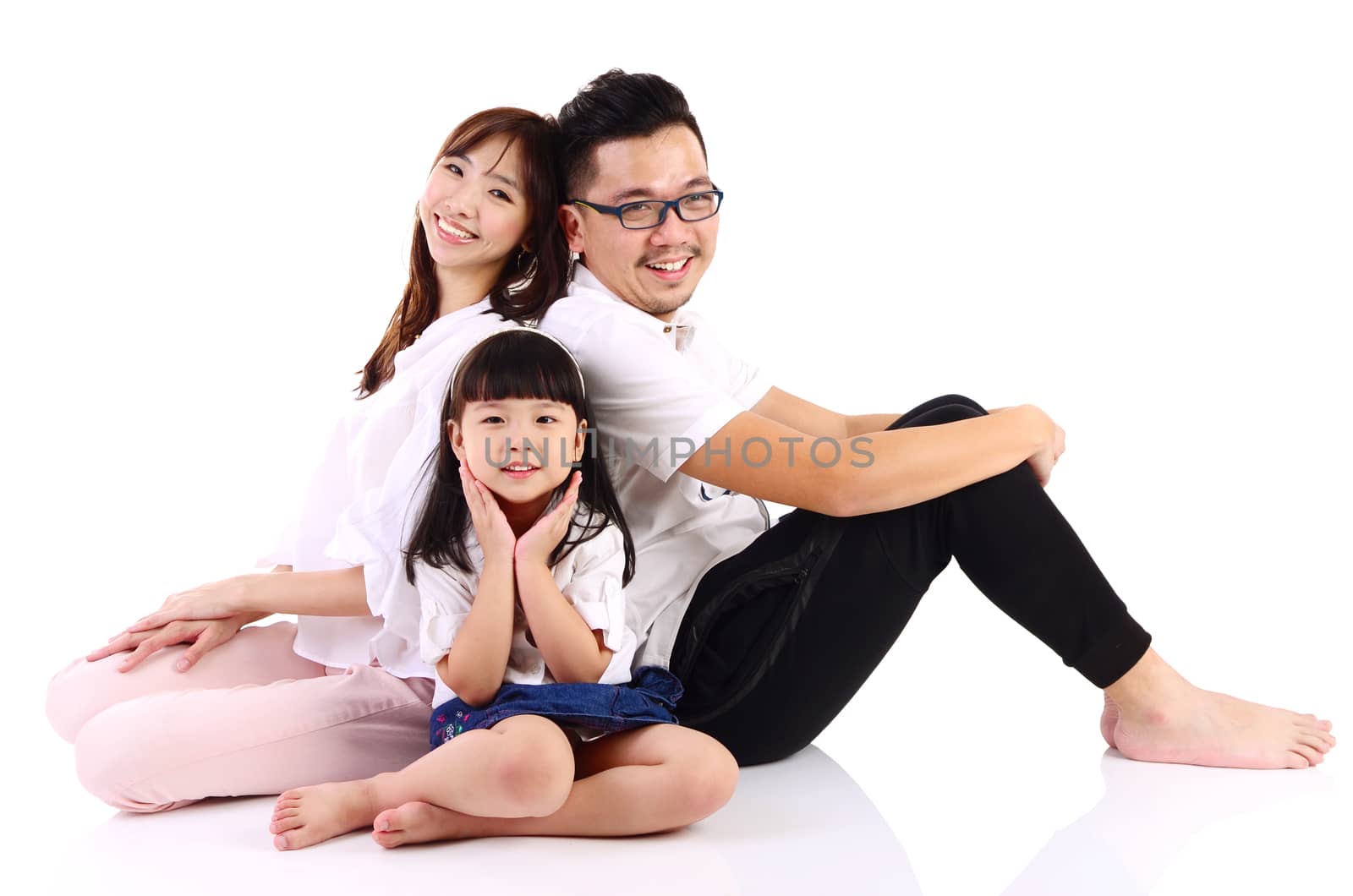 Portrait of a happy asian family in the studio