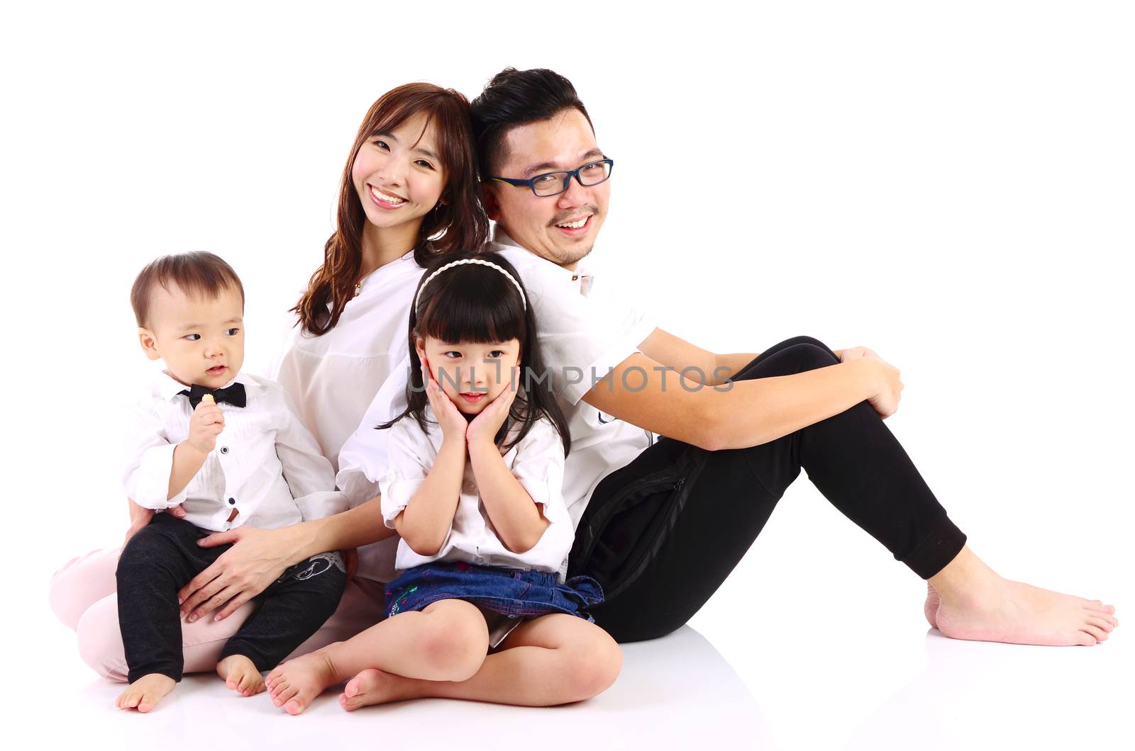 Indoor portrait of a happy asian family