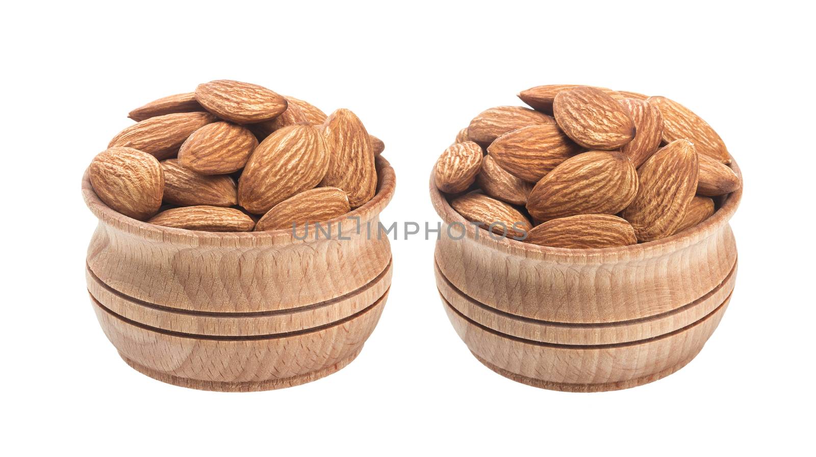 Almond nut in wooden bowl isolated on a white background by xamtiw