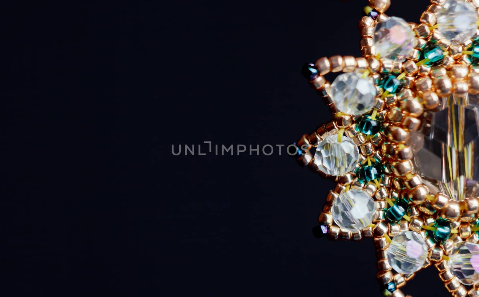 handmade jewelry made of beads in macro. earrings from white beads. earrings from stones by yulaphotographer