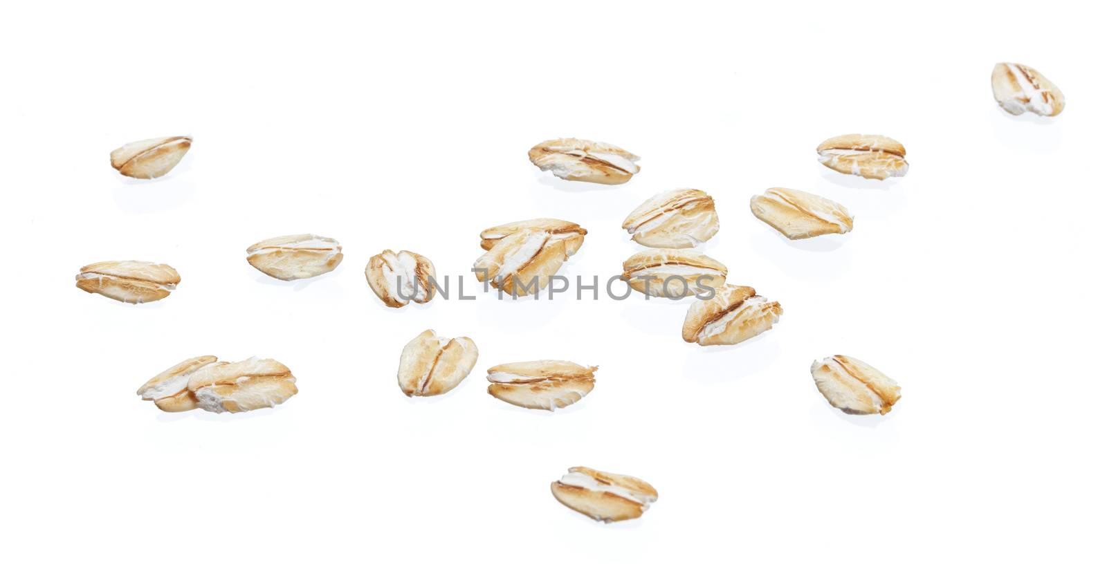 Oat flakes isolated on white background with clipping path. Close up.