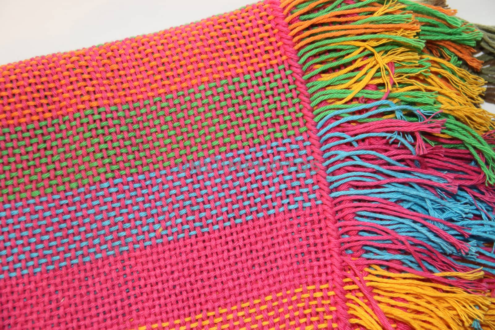 colorful knitted garments and blankets, comb loom, yarns  by GabrielaBertolini