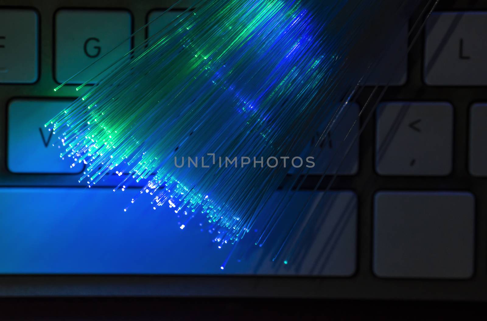 Colourful optic fibers illuminated on dark background. High spee by deyan_georgiev