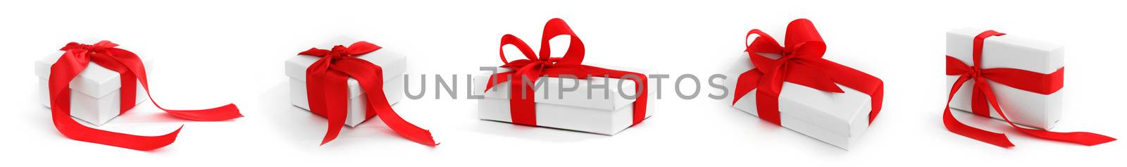 Set of white boxes tied with red satin ribbon bow isolated on white background. Gift for Christmas, Birthday, Wedding, or Valentine's day.