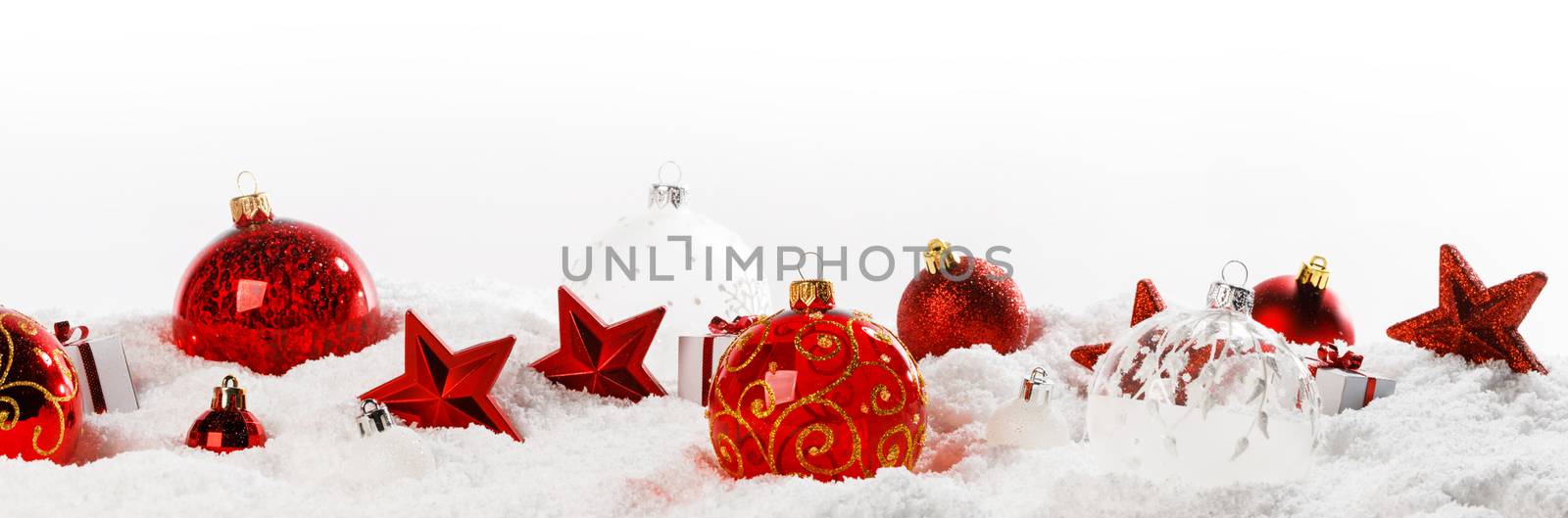 Christmas decoration frame of balls stars and gifts in snow in a row isolated on white background copy space for text design element