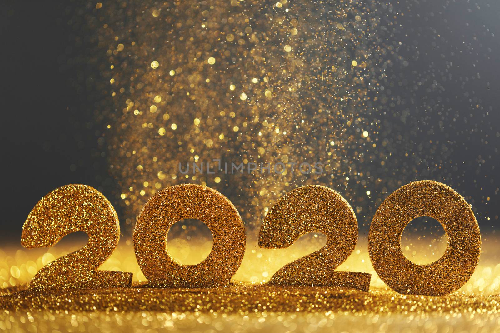 2020 New Year luxury glitter design concept numbers in golden glitters on blue background