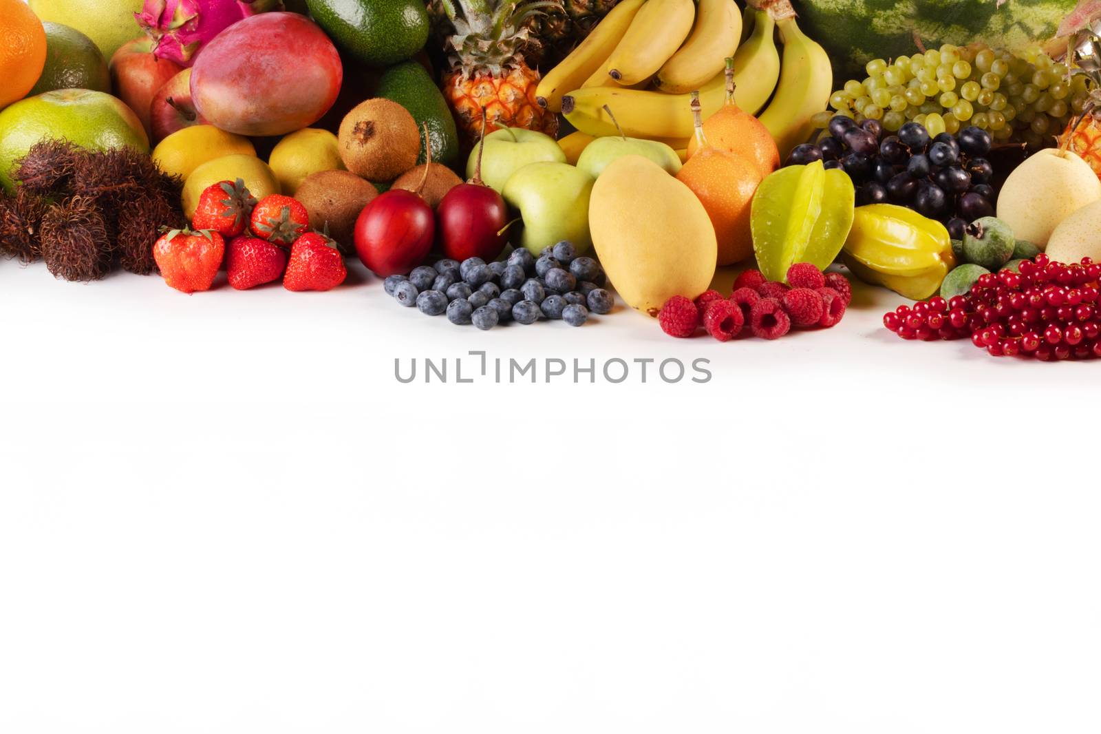 Fresh tropical fruits harvest pile isolated on white background with copy space for text