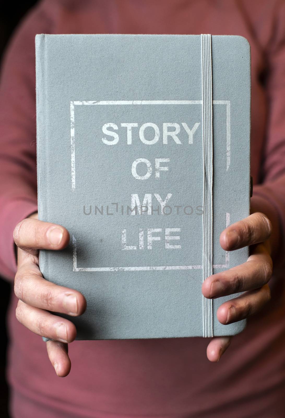 Woman hold notebook. Book notes for the Story of my life. Personal memoirs notes concept. Hands hold book.