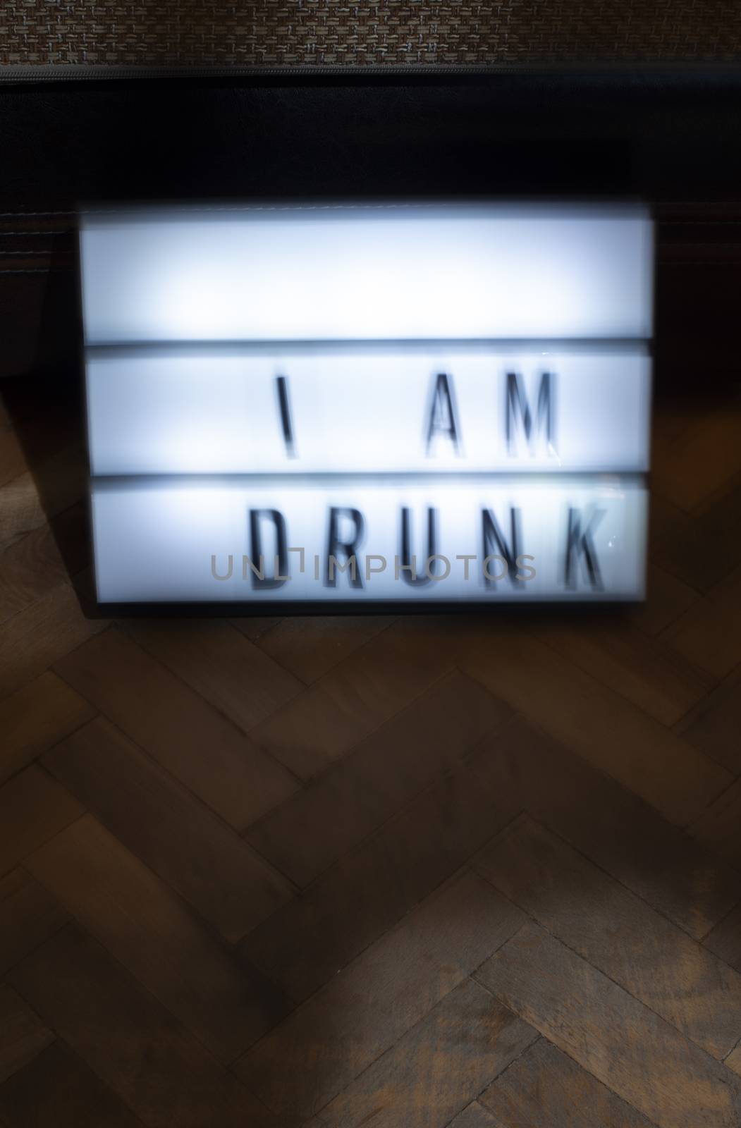 Text - Sorry I am drunk on white illuminated board. Concept for alcohol and drinking. Blurred text.