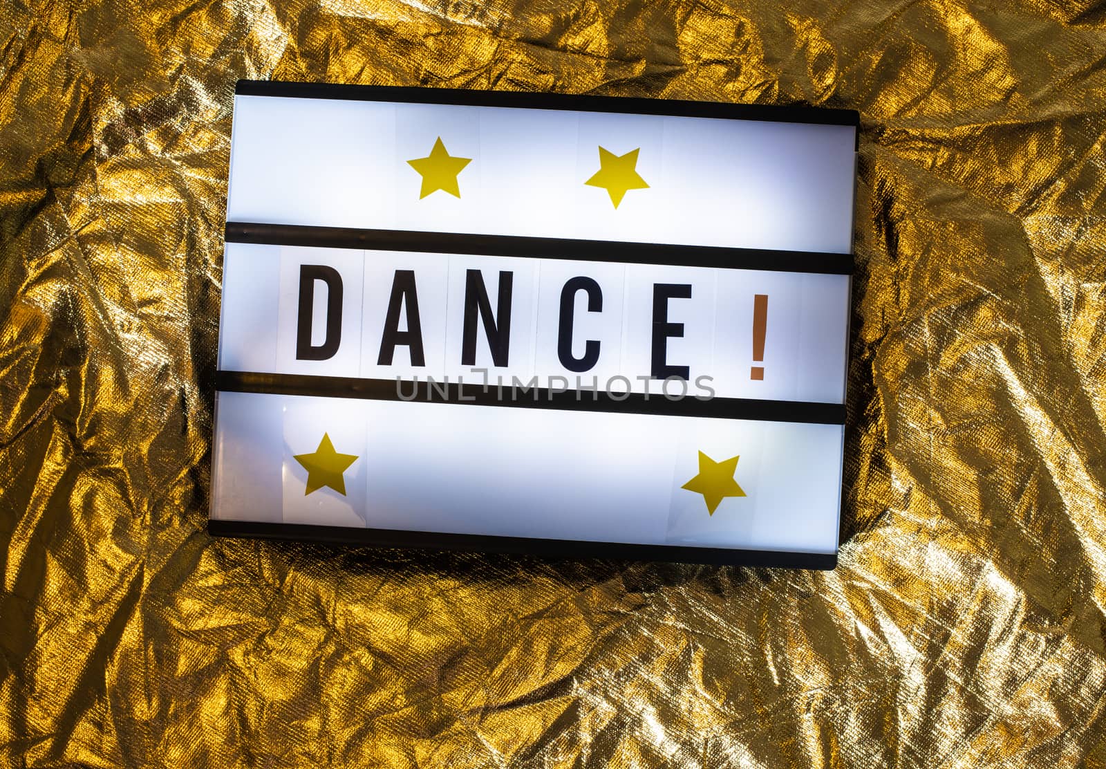 Text Dance on white illuminated board. Conceptual message for entertainment. Announcement concept.