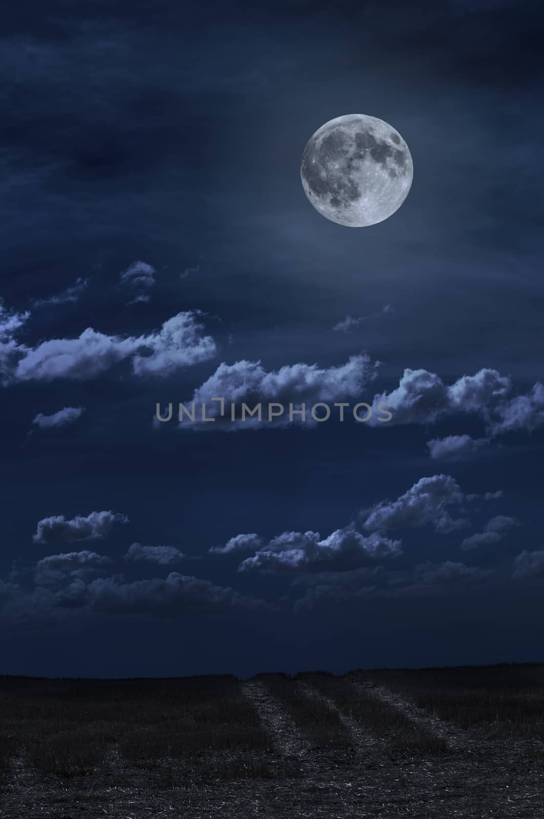 Moon and clouds in the night. Moonlight and road background. Dark blue backdrop.