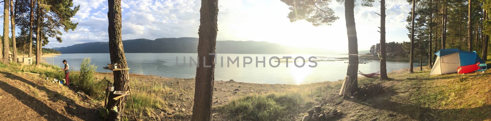 Panoramic image of forest and mountain lake. Tents and car in th by deyan_georgiev