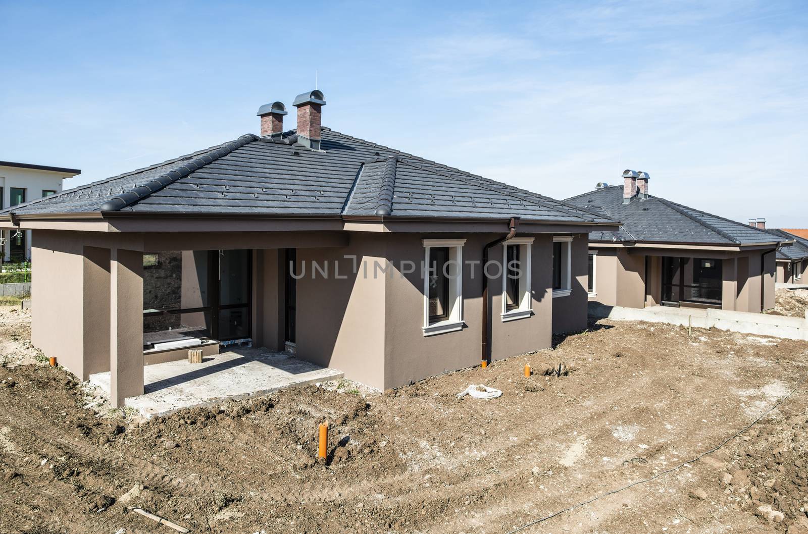 New build houses. Sunny day. Construction site