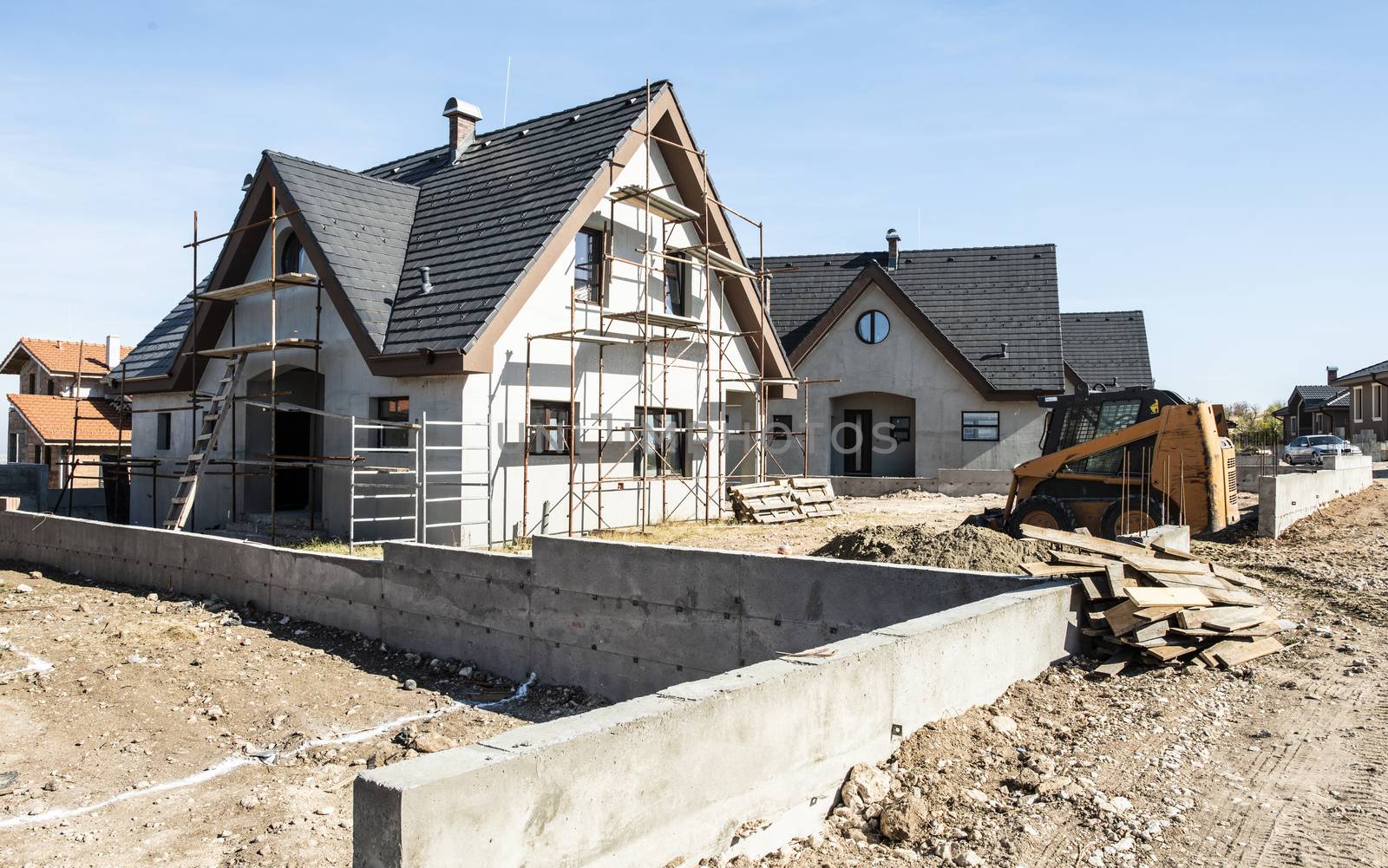 New build houses. Black roof, mountain