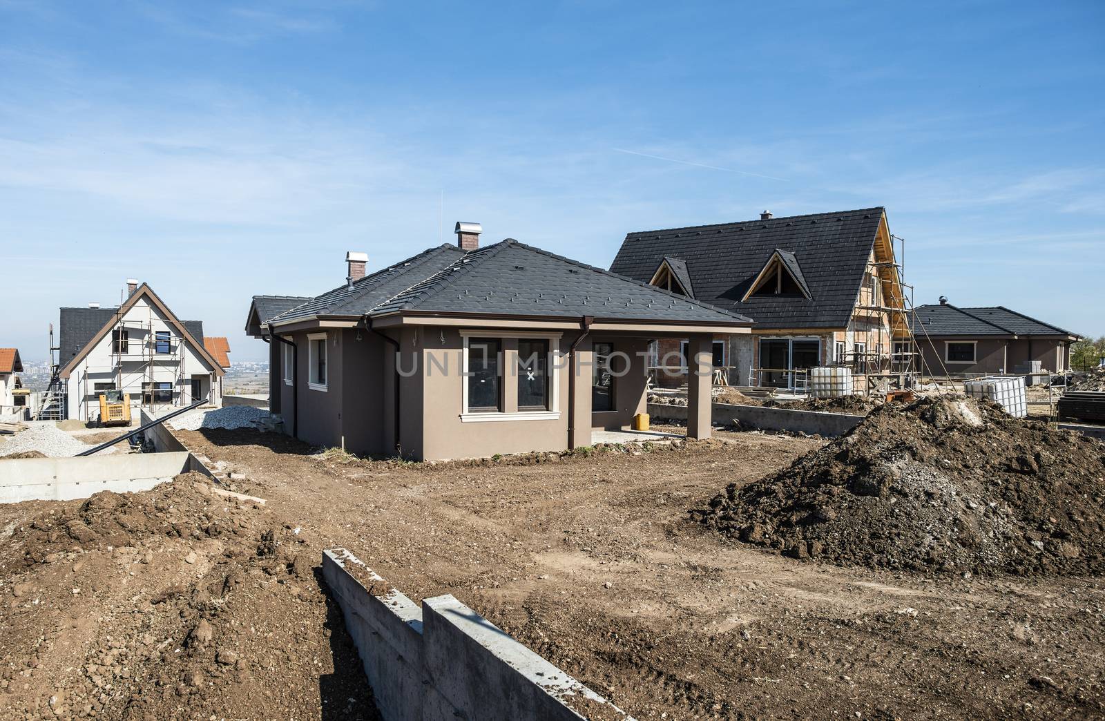 New build houses. Sunny day. Construction site