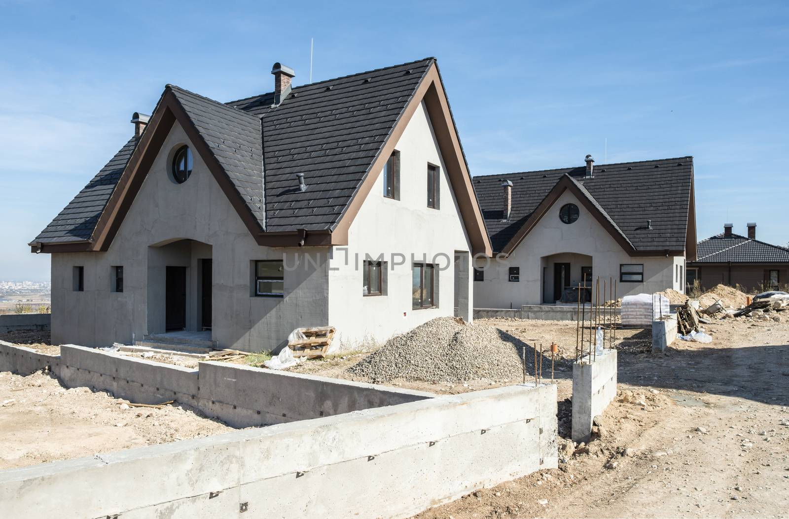 New build houses. Black roof, mountain