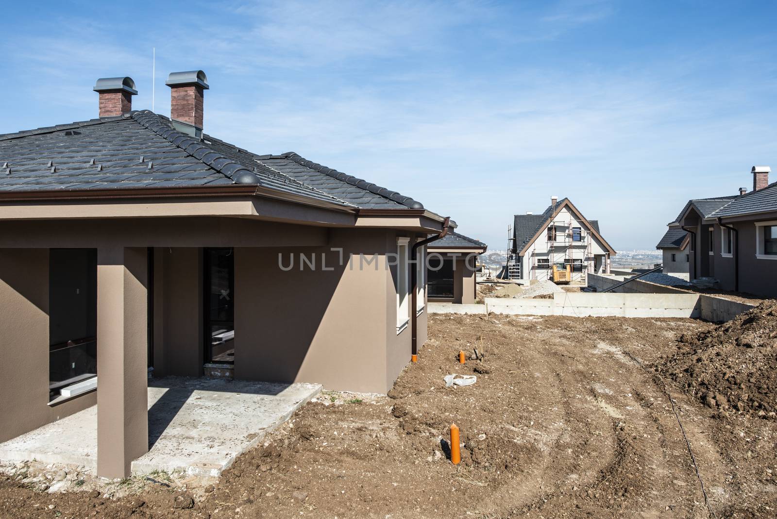 New build houses. Sunny day. Construction site