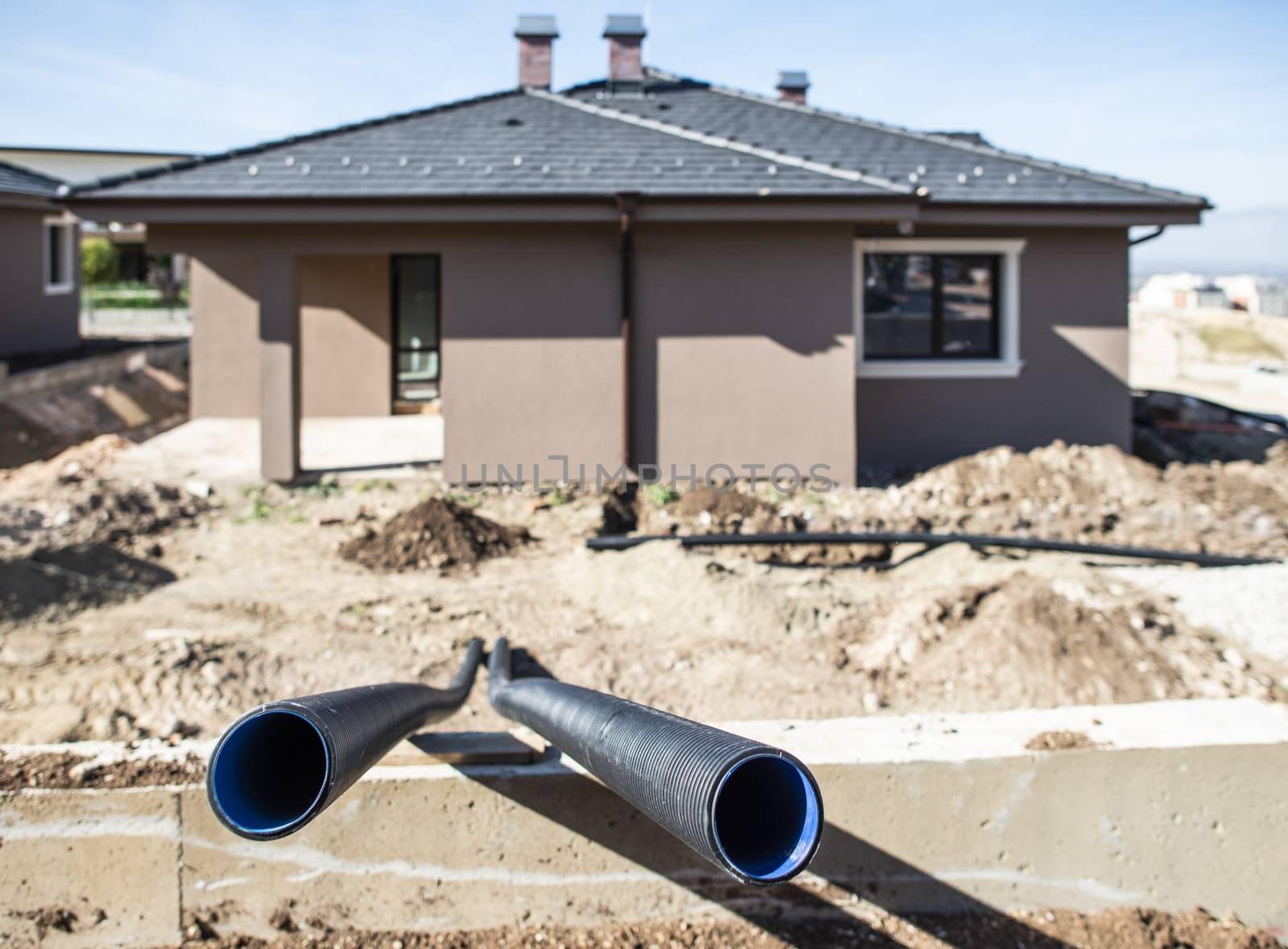 Pipes in new build house. Sunny day