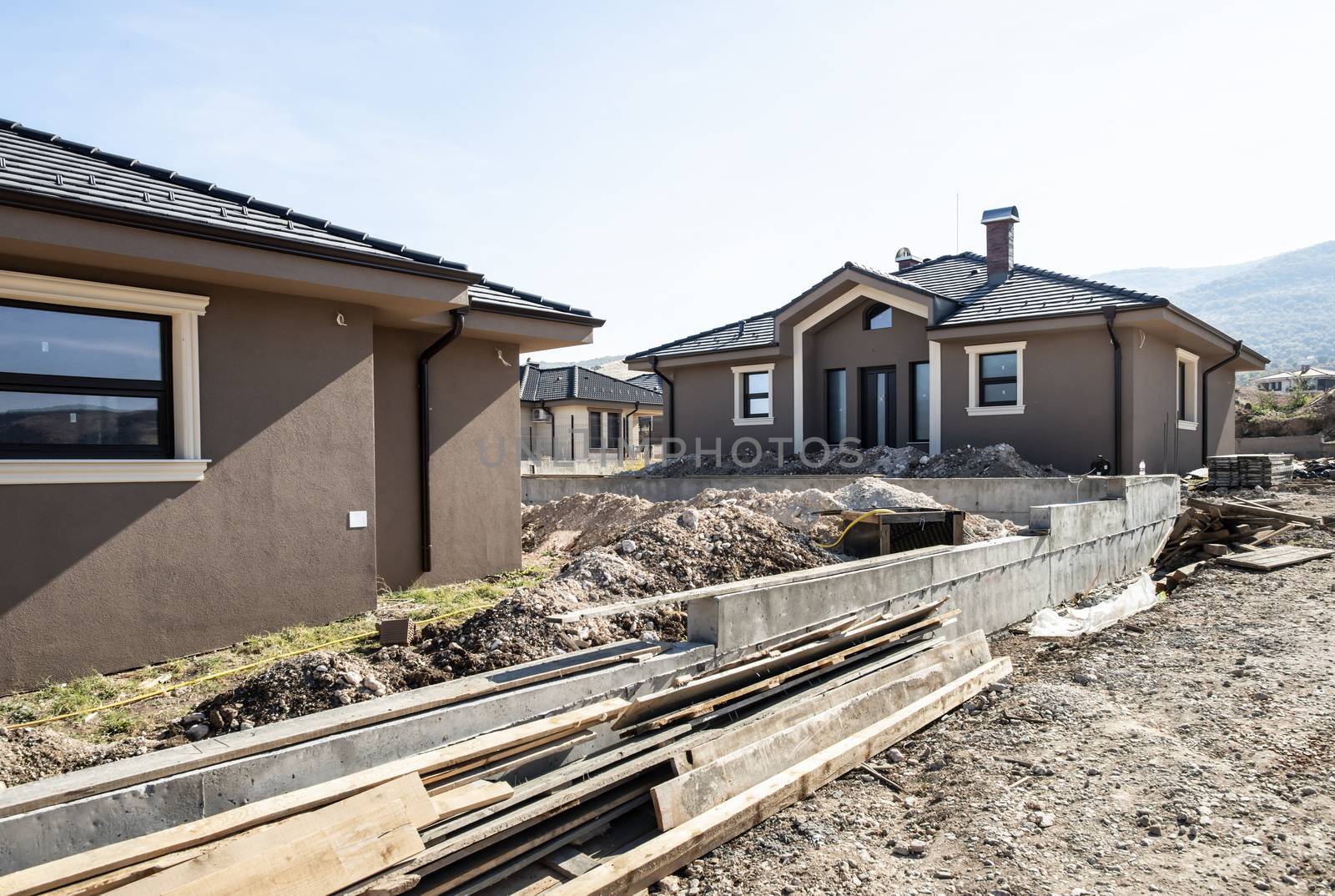 New build houses. Sunny day. Construction site