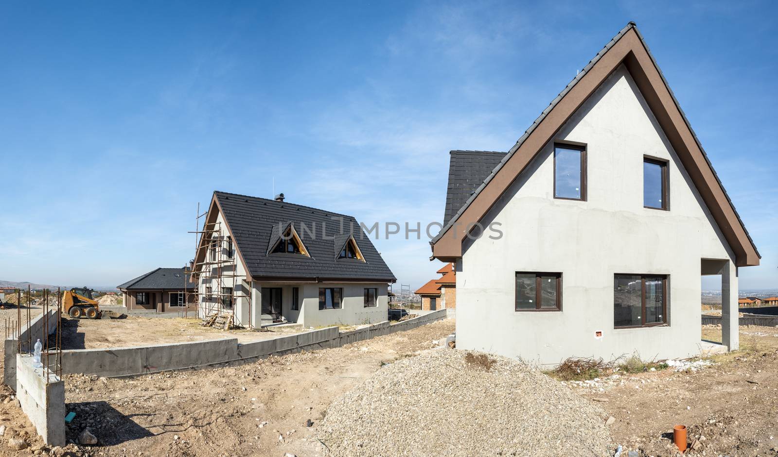 New build houses. Black roof, mountain