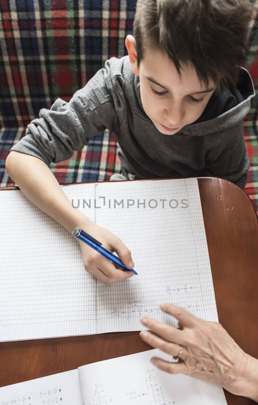 Boy do his homework. Notebook