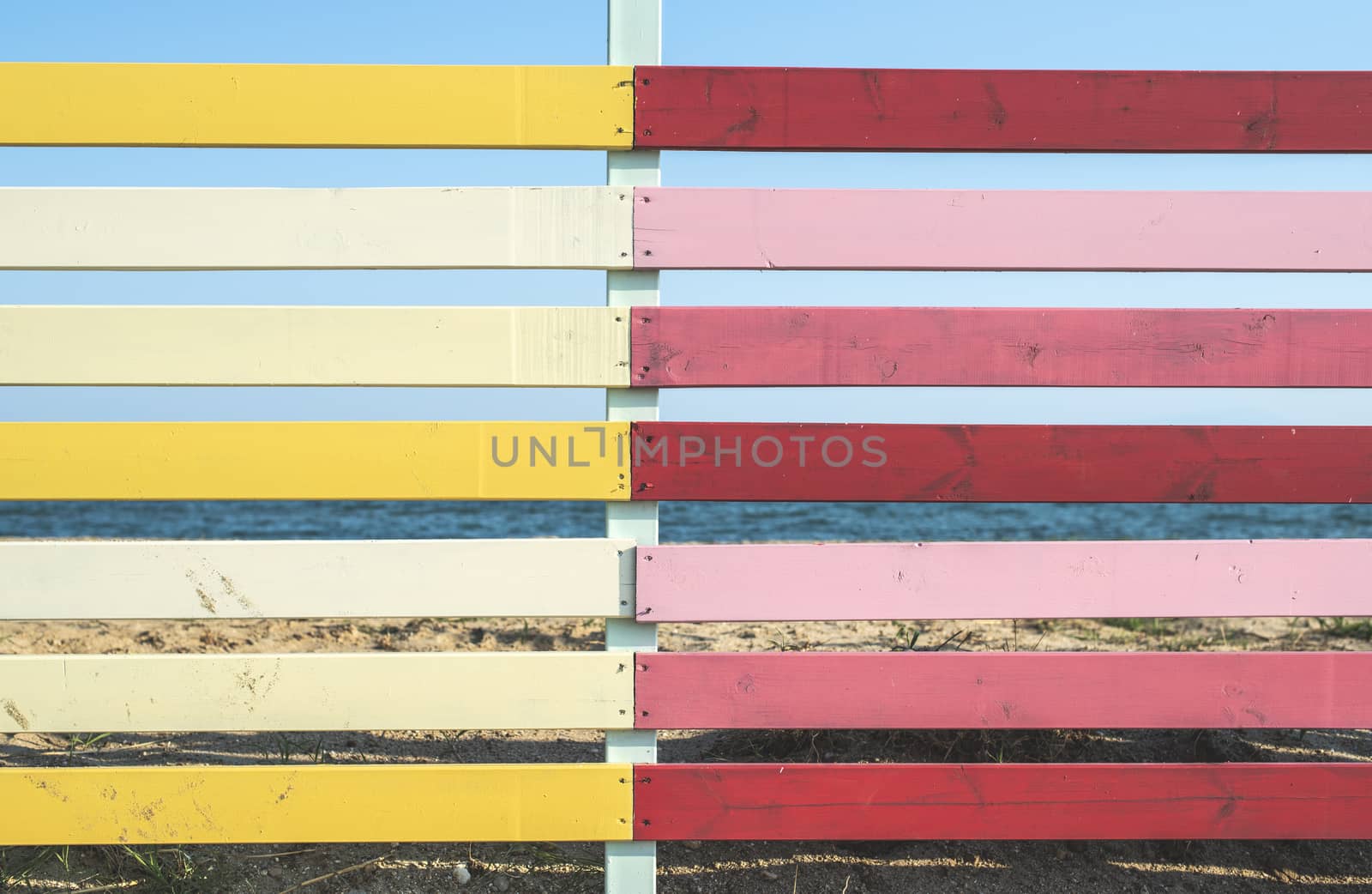 Red and yellow planks background. Sunny day