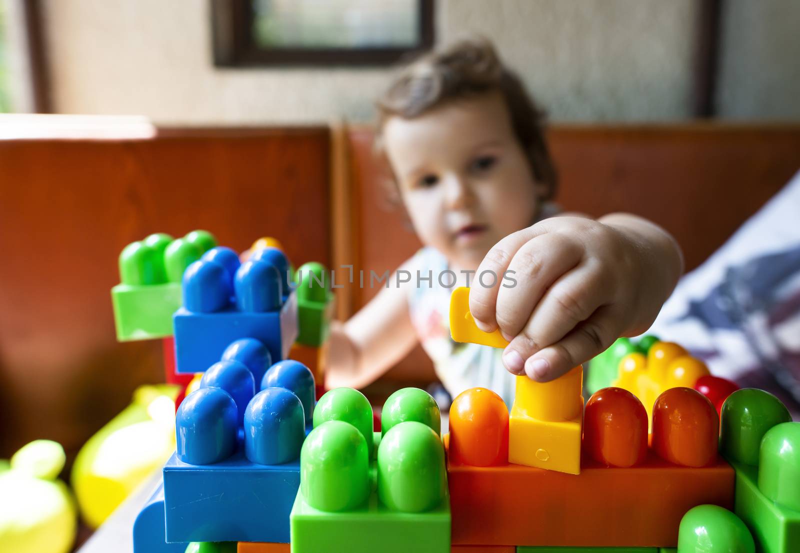 Child playing with cubes by deyan_georgiev