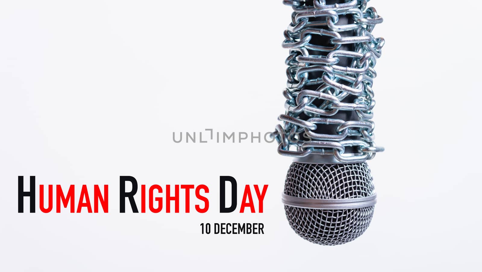 Chain on microphone with HUMAN RIGHTS DAY 10 december text on white background, Human rights day concept