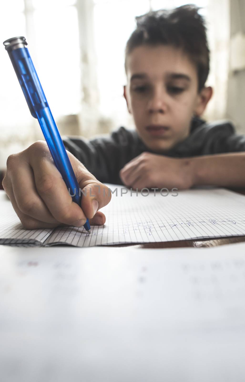 Child do his homework on mathematic