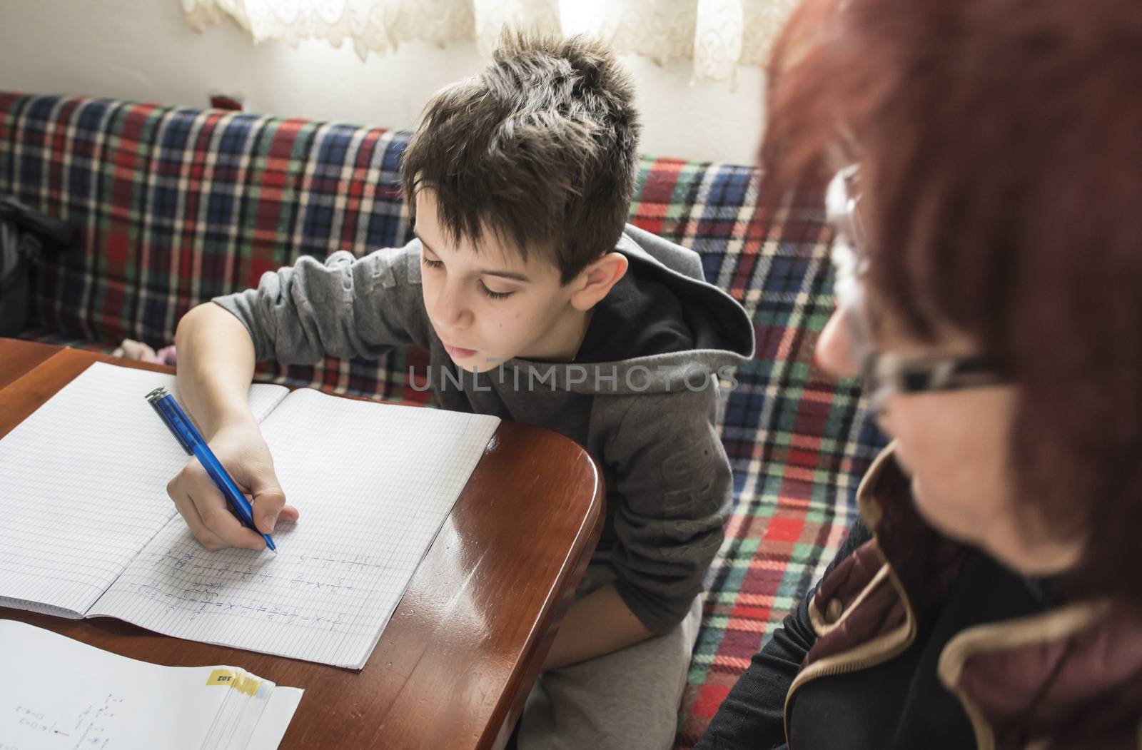 Boy do his homework. Notebook