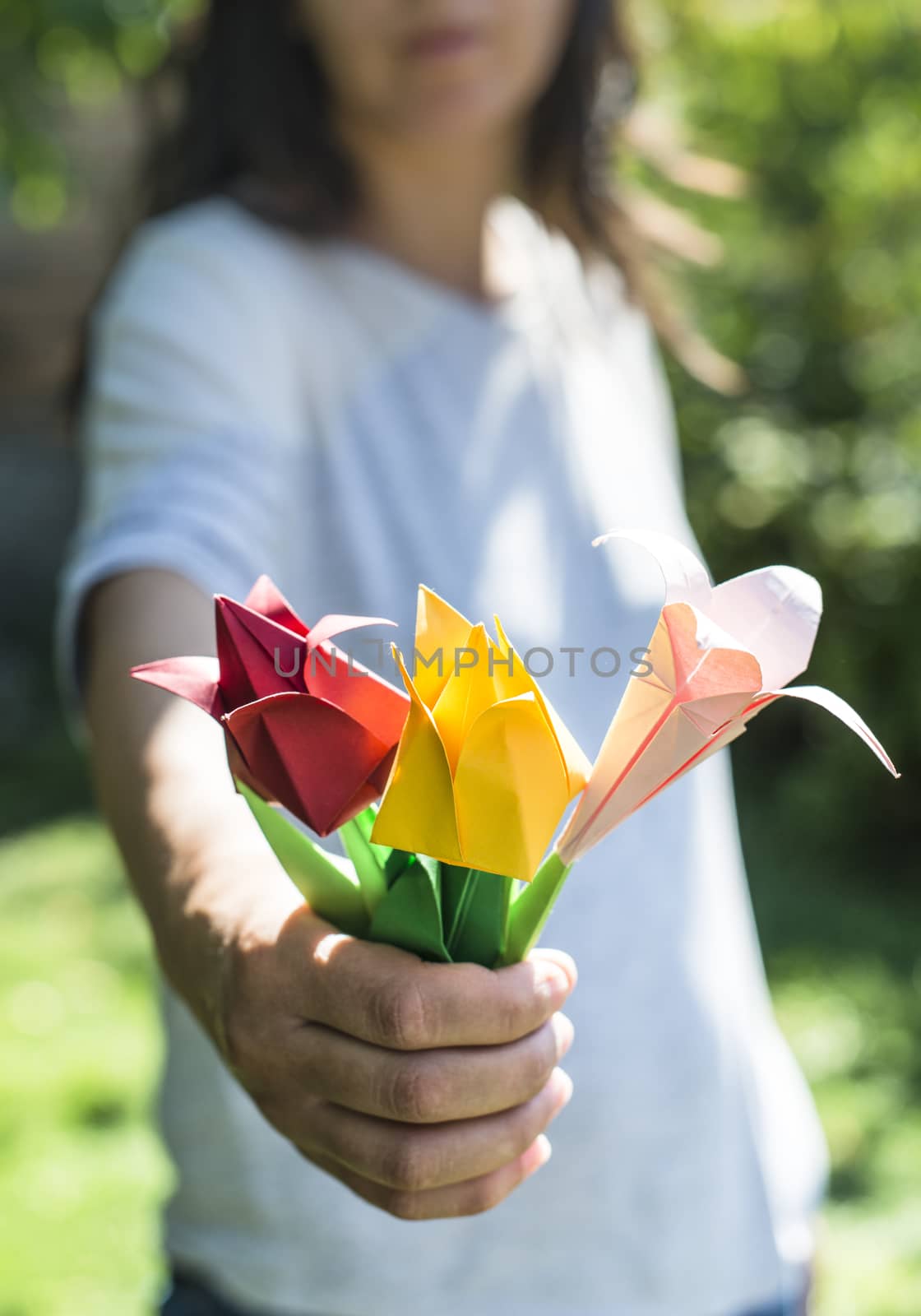 Woman hold bouquet of origami flowers by deyan_georgiev
