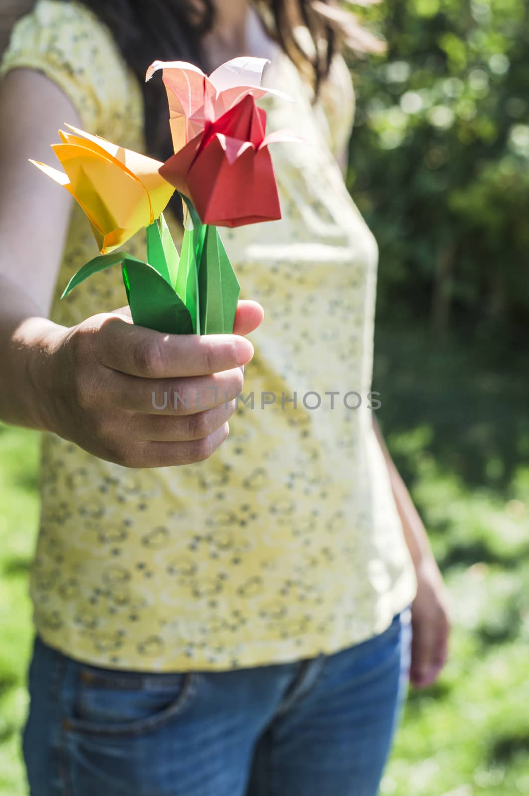 Woman hold bouquet of origami flowers by deyan_georgiev