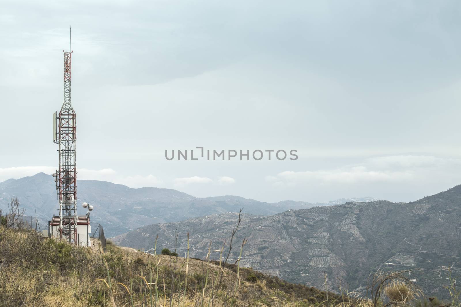 Telecommunication (GSM) towers with TV antennas on the mountain