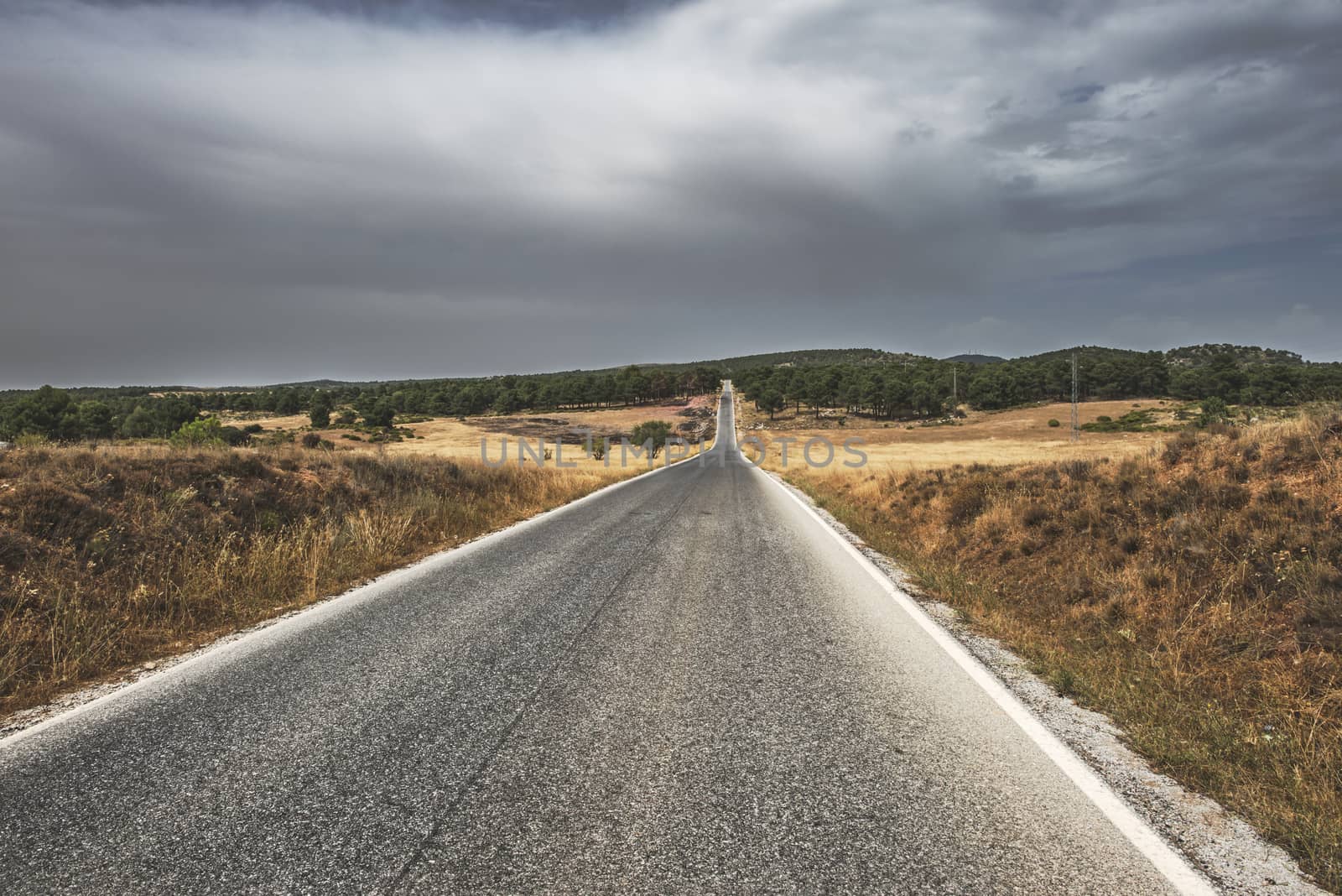 Road and dramatic cloudy sky