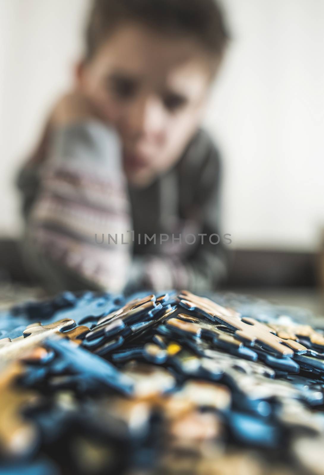 Child and puzzle. by deyan_georgiev