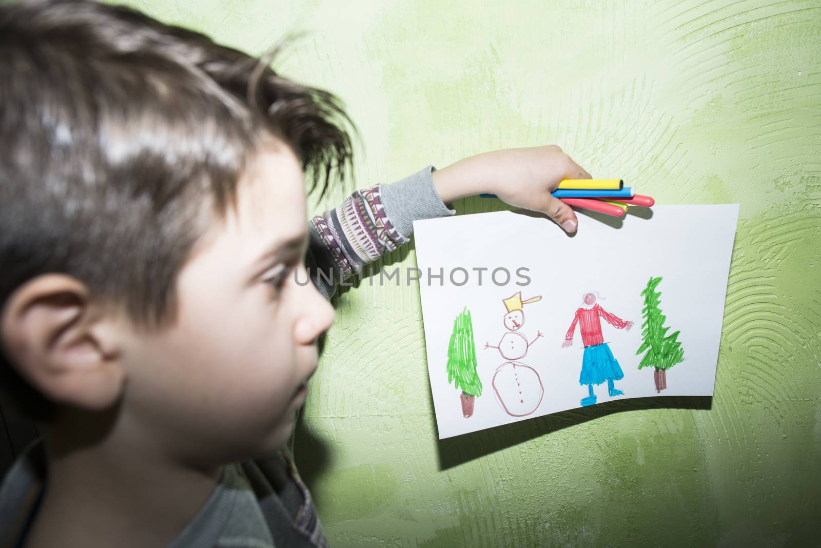 Child shows picture. Direct on camera flash