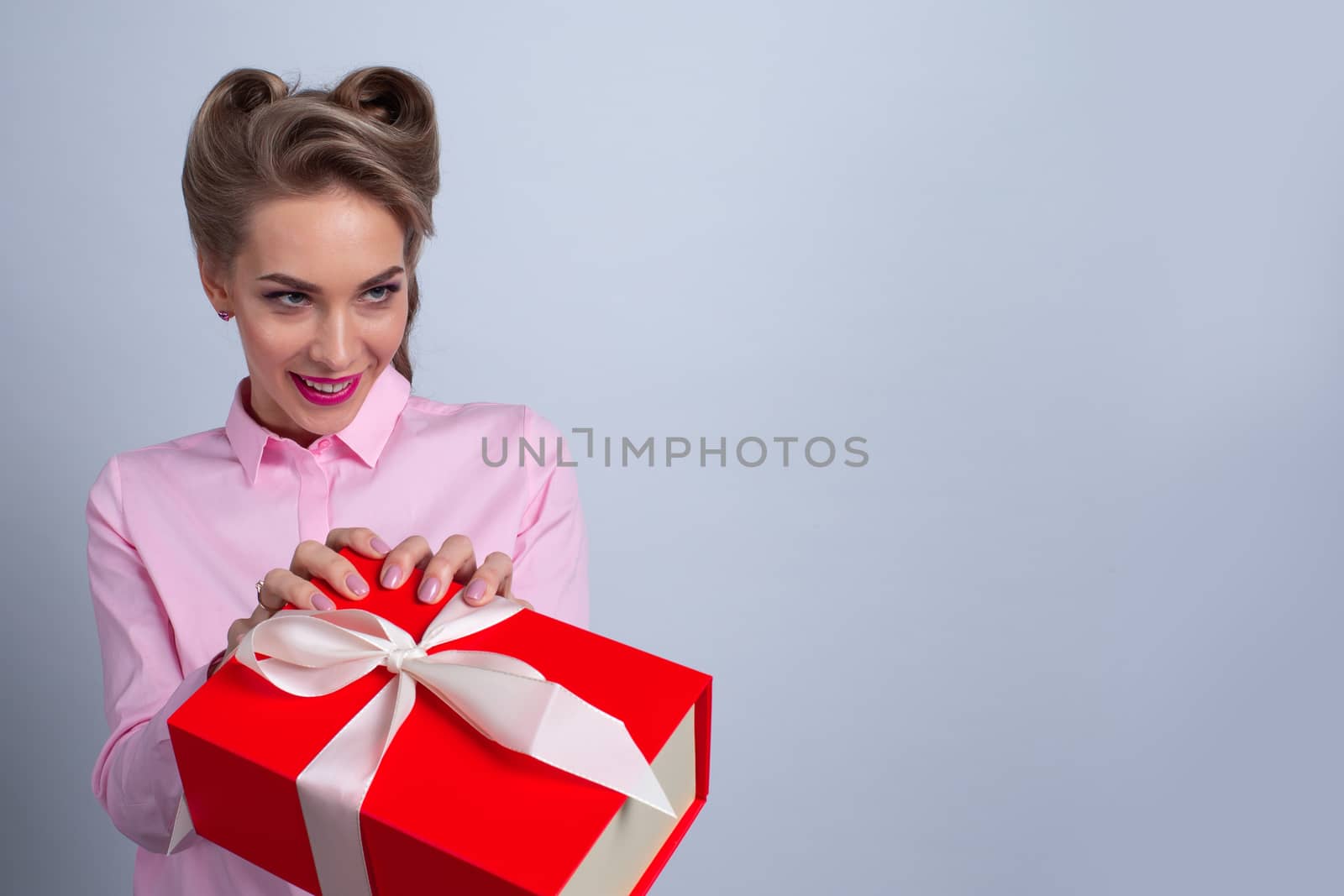 Funny happy woman taking red gift box - Christmas, new year, birthday, Valentine, Valentines day