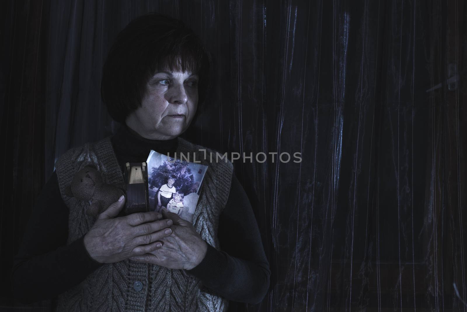 Senior woman hold pictures by deyan_georgiev