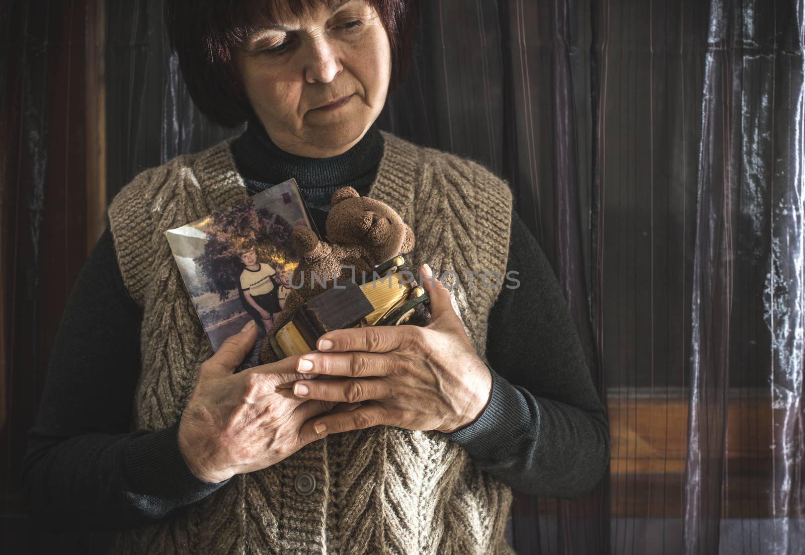 Senior woman hold pictures by deyan_georgiev