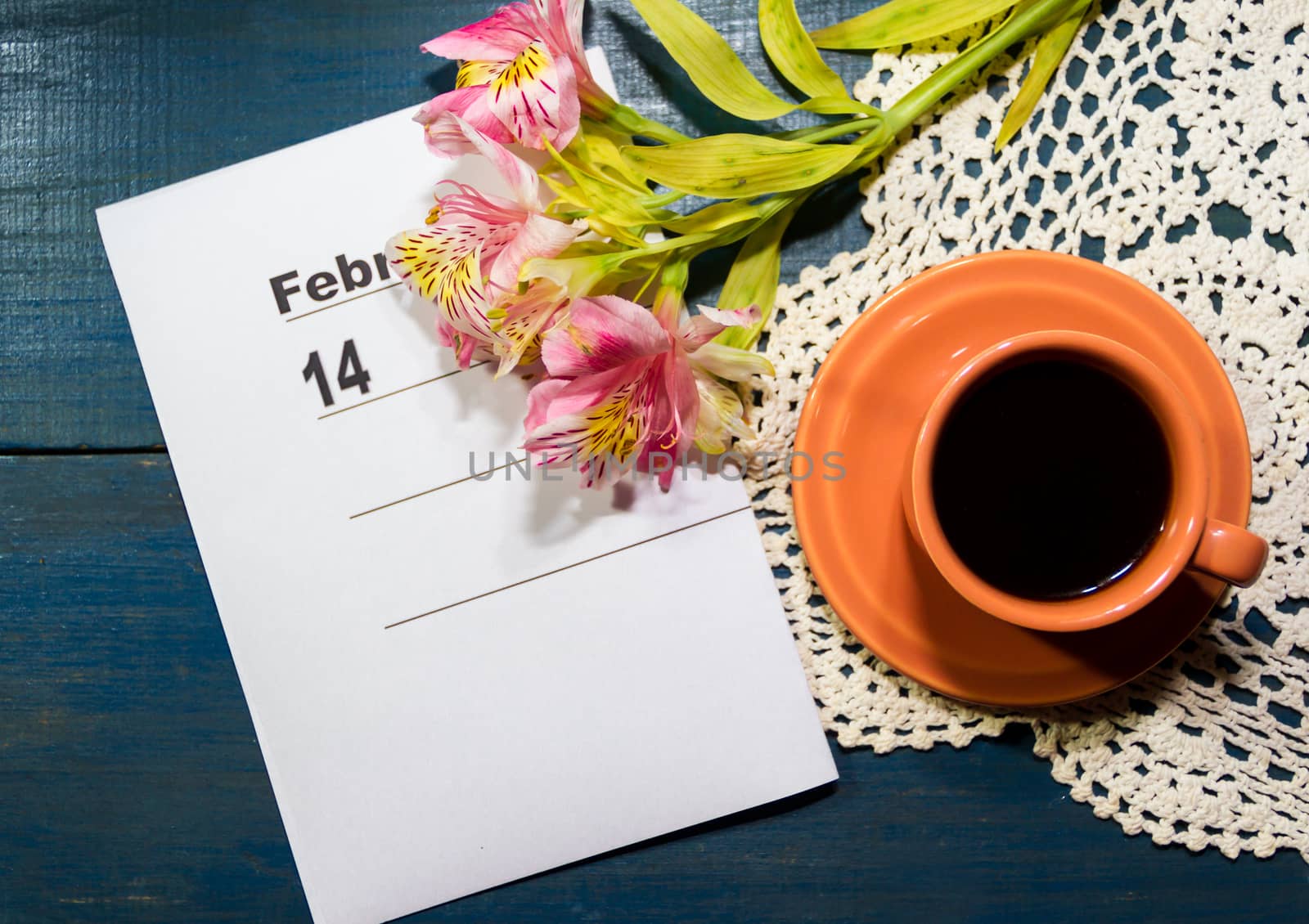 cup of coffee with flowers and note with place for text
