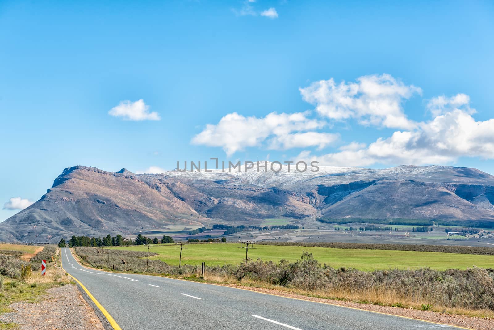 The landscape on road R46 near Ceres in the Western Cape Province. Snow is visible on the Theronsberg Mountains