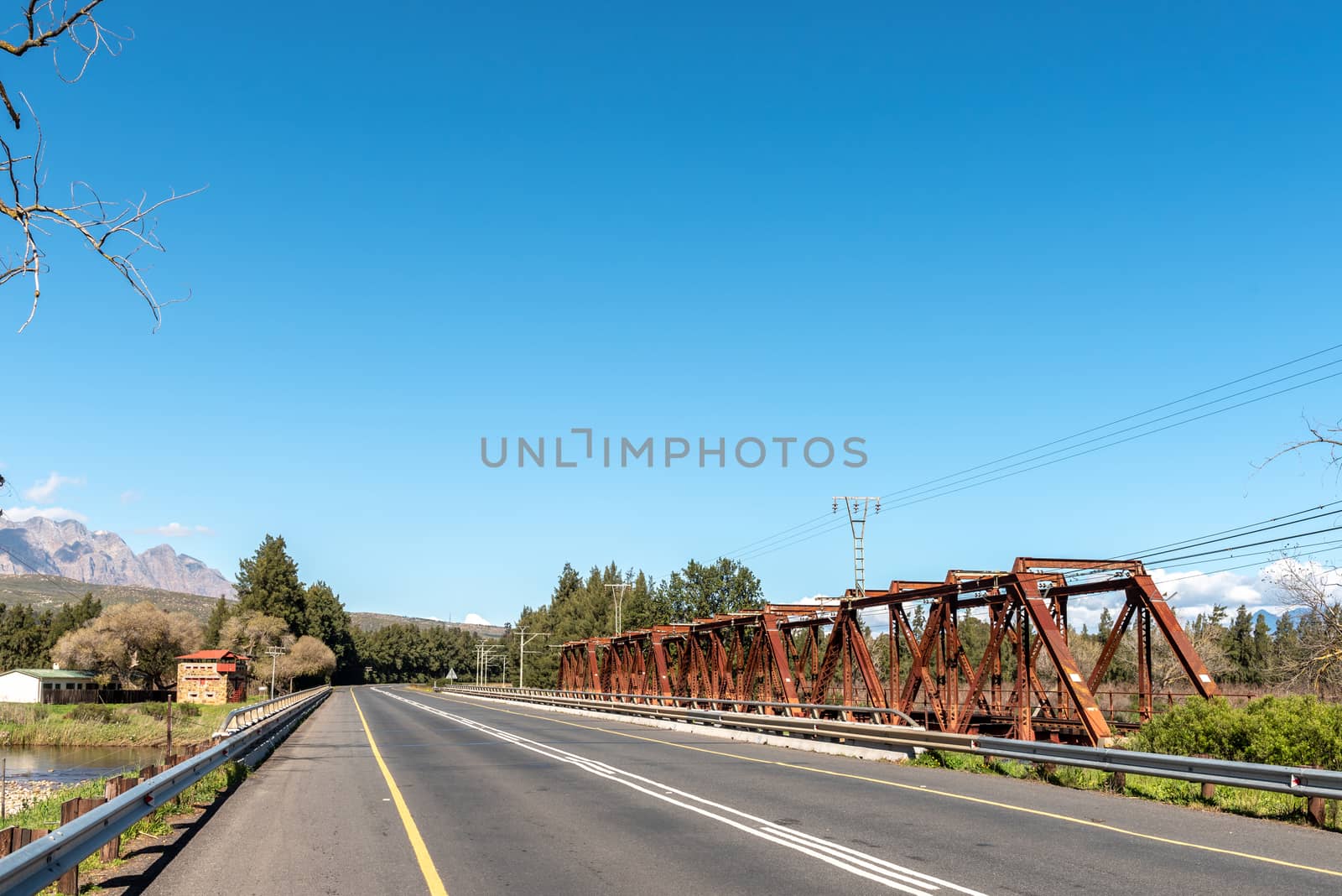 The road bridge and historic railway bridge over the Breede River at Wolseley in the Western Cape Province. An historic blockhouse is visible