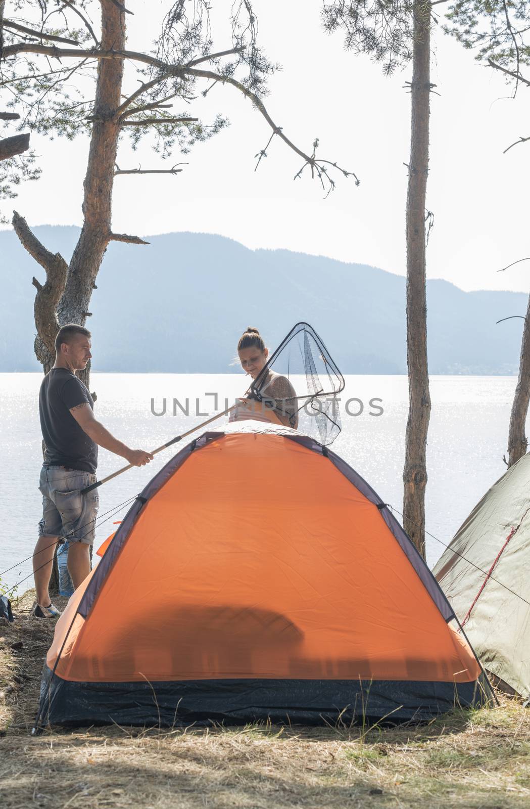 Boy and girl on a campsite by deyan_georgiev