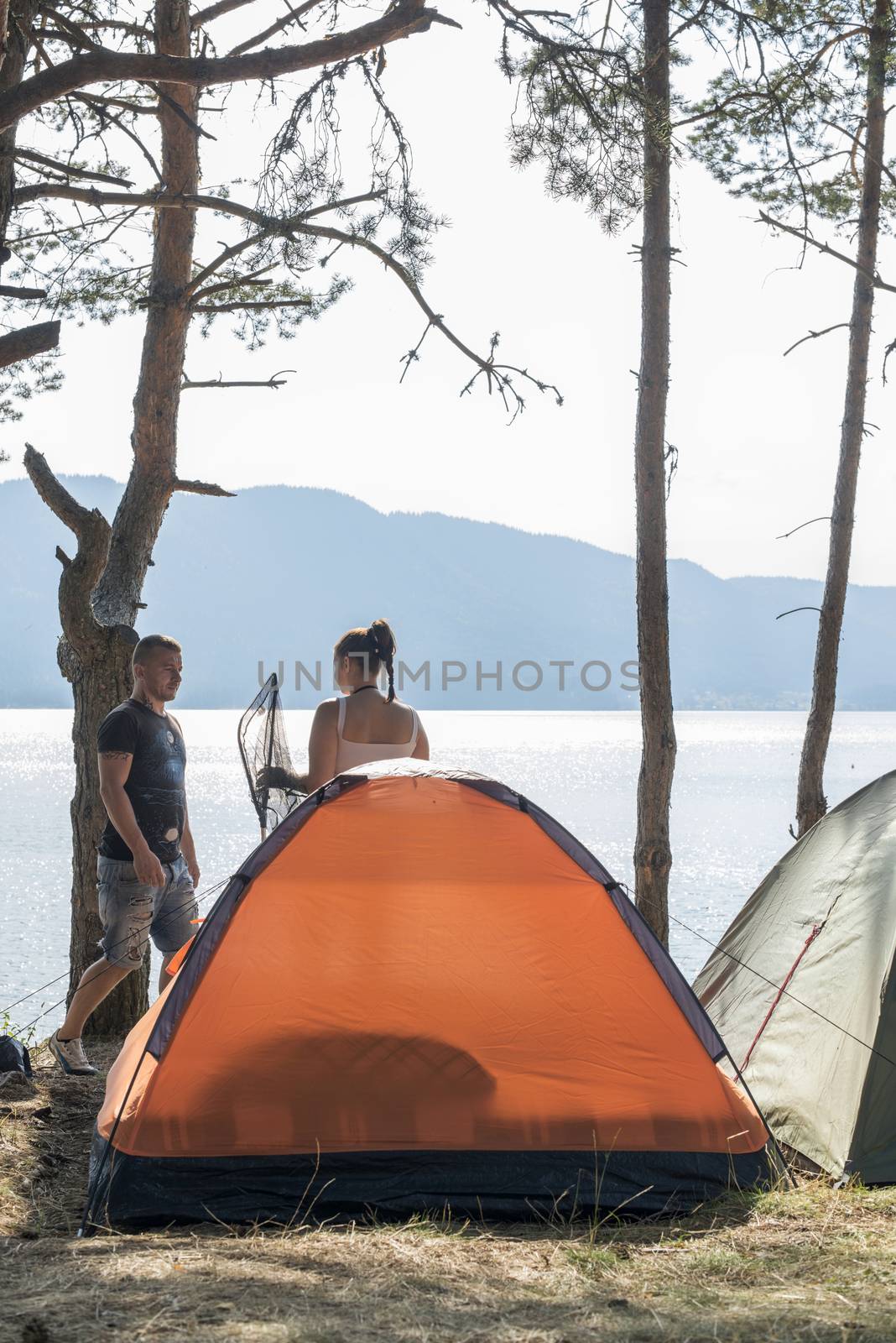 Boy and girl on a campsite by deyan_georgiev