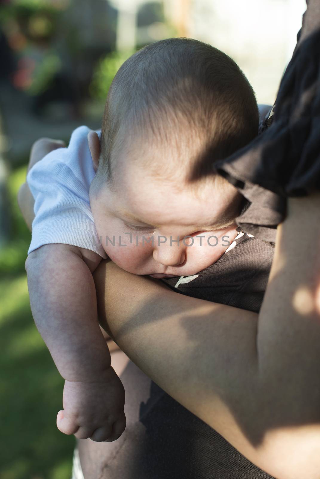 Baby in his mother's arms by deyan_georgiev