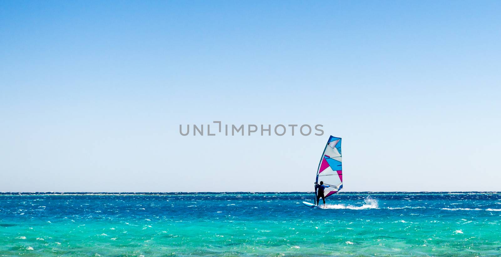 surfer rides in the Red Sea in Egyp