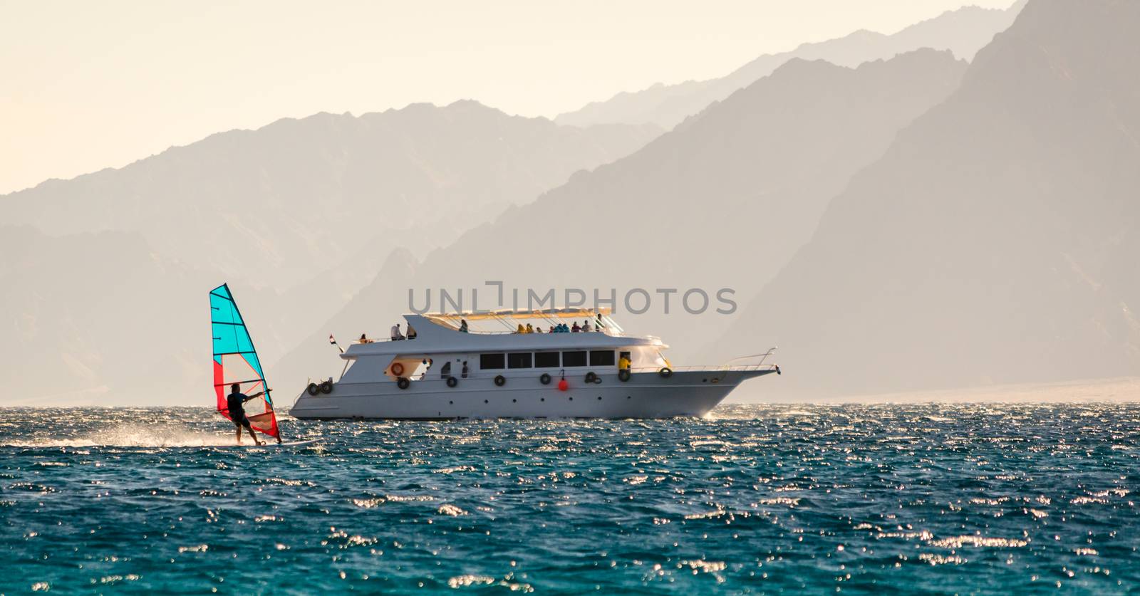 big boat and windsurfer on the background of high mountains in Egypt Dahab