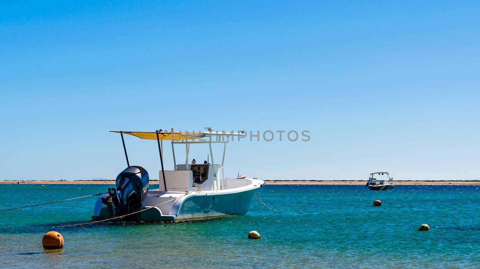 two boats in the sea on the background of the coast in Egypt